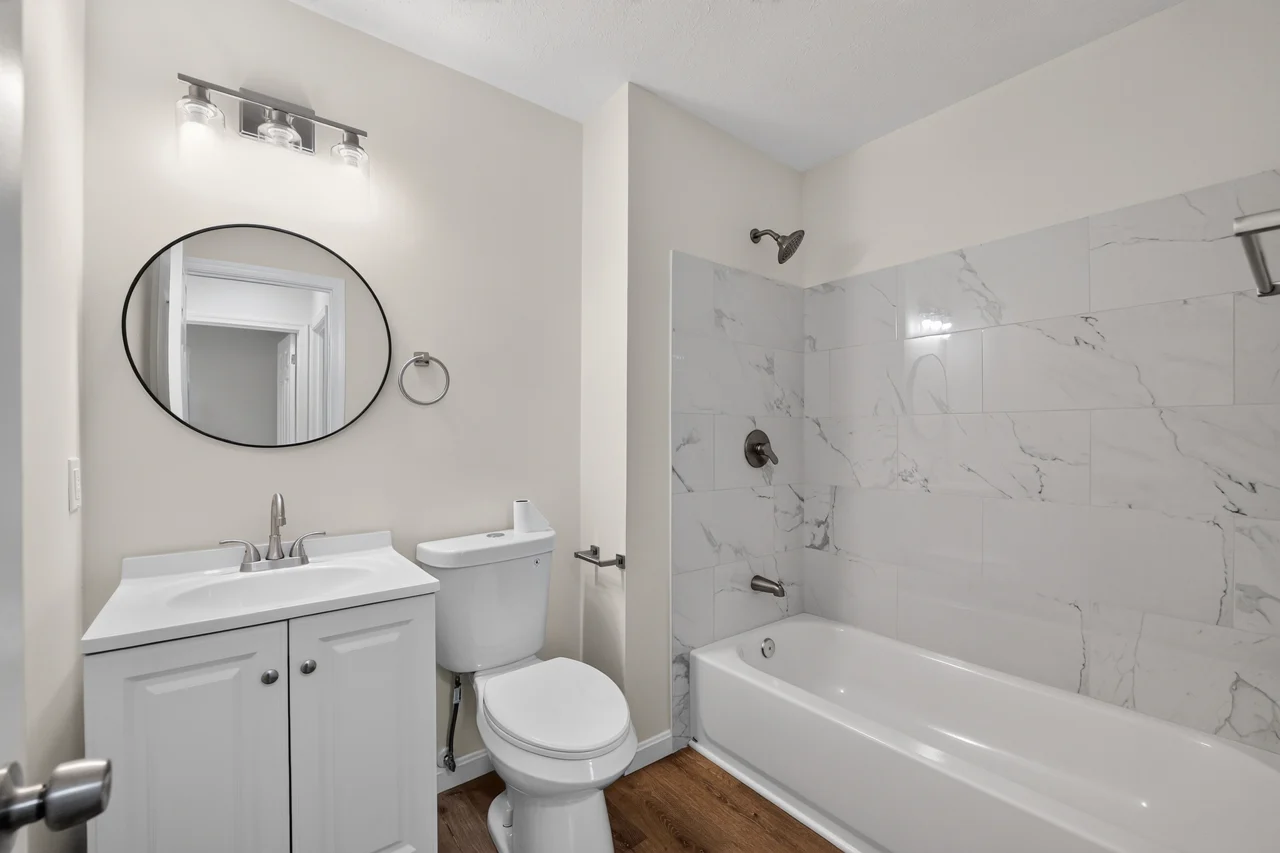 Full bathroom with tub and vanity